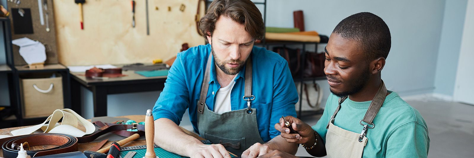 Two international men working in a workshop